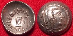 HIMYAR KINGDOM (The Homerites) AR silver scyphate 'quinarius'. 80-120 AD, under Amdan Bayan Yahaqbid. Head of deity with trid...